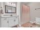 Clean bathroom featuring a shower with a patterned curtain and neutral vanity at 725 S State St, Raleigh, NC 27601