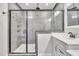 Glass enclosed shower with granite and tile surround at 725 S State St, Raleigh, NC 27601