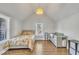 Bright bedroom featuring a bed, crib, and a window at 725 S State St, Raleigh, NC 27601