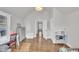 Bedroom featuring vaulted ceiling, hardwood floors, and neutral paint, offering an open and inviting atmosphere at 725 S State St, Raleigh, NC 27601