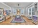 Bright dining room showcasing hardwood floors, modern lighting fixture, and convenient access to the kitchen's beverage center at 725 S State St, Raleigh, NC 27601