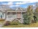 Charming home featuring a inviting front porch, well-maintained landscaping, and a vibrant orange front door at 725 S State St, Raleigh, NC 27601