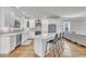 Open kitchen with a center island, stainless appliances, and lots of lighting at 725 S State St, Raleigh, NC 27601