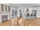 Well-lit kitchen with granite countertops, stainless appliances, and wine fridge at 725 S State St, Raleigh, NC 27601