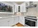Kitchen with granite countertops, decorative backsplash, and stainless appliances at 725 S State St, Raleigh, NC 27601