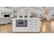 Kitchen island with a microwave and granite countertops at 725 S State St, Raleigh, NC 27601