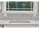 Kitchen sink with granite countertops and a view of the backyard at 725 S State St, Raleigh, NC 27601