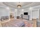 Bright main bedroom featuring trey ceilings, hardwood floors, and an ensuite bathroom providing comfort and style at 725 S State St, Raleigh, NC 27601