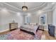 Primary bedroom featuring trey ceilings, hardwood floors, and windows offering natural light creating an open and airy feel at 725 S State St, Raleigh, NC 27601