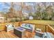 Relaxing wooden deck with comfortable outdoor furniture and a warming fire pit at 725 S State St, Raleigh, NC 27601