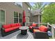 Beautiful deck with red patio furniture, a fire pit, and views of the wooded backyard at 7517 Summer Pines Way, Wake Forest, NC 27587