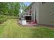 Charming backyard features green grass, patio, wooded area and a grill at 7517 Summer Pines Way, Wake Forest, NC 27587