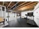Unfinished basement with black ceilings and workout equipment, perfect for a home gym at 7517 Summer Pines Way, Wake Forest, NC 27587