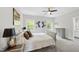 Spacious bedroom featuring soft carpet, neutral paint, ceiling fan, and an ensuite bathroom at 7517 Summer Pines Way, Wake Forest, NC 27587