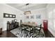 Elegant dining room with a zebra rug, dark wood floors, and decor, perfect for hosting and Gathering gatherings at 7517 Summer Pines Way, Wake Forest, NC 27587