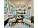 Cozy dining area with a view to the kitchen features a stylish rug and seating, creating a relaxing atmosphere at 7517 Summer Pines Way, Wake Forest, NC 27587