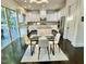 Bright kitchen and dining area with modern appliances, ample counter space, and outdoor access at 7517 Summer Pines Way, Wake Forest, NC 27587
