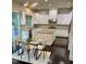 Modern kitchen with granite countertops, stainless steel appliances, and a spacious island, ideal for entertaining at 7517 Summer Pines Way, Wake Forest, NC 27587