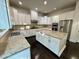Modern kitchen with granite countertops, stainless steel appliances, and an island, perfect for cooking and gathering at 7517 Summer Pines Way, Wake Forest, NC 27587
