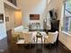Cozy living area with a fireplace, high ceilings, and large windows, offering abundant natural light at 7517 Summer Pines Way, Wake Forest, NC 27587