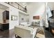 Airy living room with soaring ceilings, a fireplace, contemporary decor, and dark hardwood floors at 7517 Summer Pines Way, Wake Forest, NC 27587