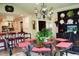 Bright dining area with a round table, chairs, chandelier and view to kitchen at 775 Sid Eaves Rd, Youngsville, NC 27596