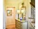 Elegant foyer featuring a decorative mirror, staircase, and beautiful wood floors at 775 Sid Eaves Rd, Youngsville, NC 27596
