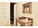 Hallway with decoratively adorned neutral colored walls, and hardwood floors at 775 Sid Eaves Rd, Youngsville, NC 27596