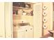 Convenient laundry closet equipped with washer and dryer unit and extra storage space at 775 Sid Eaves Rd, Youngsville, NC 27596