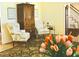 Comfortable chairs accent this cozy living room, complete with patterned rug and cabinet at 775 Sid Eaves Rd, Youngsville, NC 27596