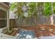 Backyard with a privacy fence, a small patio, and lush landscaping at 8124 Greywinds Dr, Raleigh, NC 27615