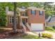 Charming brick home featuring well-manicured landscaping and an attached two-car garage at 8124 Greywinds Dr, Raleigh, NC 27615