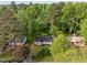 Aerial view of home with yard and mature trees at 84 Honeysuckle Dr, Pittsboro, NC 27312