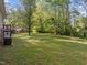 Picture of backyard with green grass at 84 Honeysuckle Dr, Pittsboro, NC 27312
