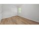 Bright bedroom features new floors, new paint, a window, and closet at 84 Honeysuckle Dr, Pittsboro, NC 27312