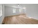 Bright living room with luxury vinyl plank flooring, neutral paint, and ceiling fan at 84 Honeysuckle Dr, Pittsboro, NC 27312