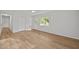 Spacious living room with luxury vinyl plank flooring, neutral walls, and ceiling fan at 84 Honeysuckle Dr, Pittsboro, NC 27312