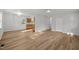 Open-concept living space with updated flooring flowing into kitchen area at 84 Honeysuckle Dr, Pittsboro, NC 27312
