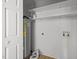 Spacious utility room features a water heater, shelving, and easy access to plumbing at 84 Honeysuckle Dr, Pittsboro, NC 27312