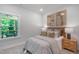 Bright bedroom featuring soft grey carpet, stylish decor, and a view to the outside porch at 8704 Maxine St # 1, Willow Springs, NC 27592