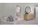 Comfortable bedroom with en-suite bathroom access, decorative lighting, and modern furnishings at 8704 Maxine St # 1, Willow Springs, NC 27592