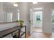 Bright entryway features wood floors, neutral walls, and modern decor at 8704 Maxine St # 1, Willow Springs, NC 27592