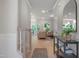 Light-filled hallway showcasing the hardwood floors and an open floor plan leading to the living area at 8704 Maxine St # 1, Willow Springs, NC 27592