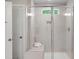 Brightly lit shower includes a bench, window, showerhead and hand wand at 8704 Maxine St # 1, Willow Springs, NC 27592