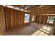 Unfinished bedroom featuring exposed wood framework, offering a glimpse into the construction process at 91 Gobbler Dr, Smithfield, NC 27577