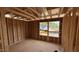 Unfinished bedroom, ready for customization, showcasing the framing and window placements at 91 Gobbler Dr, Smithfield, NC 27577