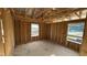 Unfinished bedroom with exposed studs and plywood sheathing, ready for customization and design at 91 Gobbler Dr, Smithfield, NC 27577
