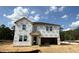 New two-story home under construction featuring a front-facing two-car garage and covered front entryway at 91 Gobbler Dr, Smithfield, NC 27577