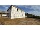 New construction two-story home with visible framework and wrap, awaiting finishing touches at 91 Gobbler Dr, Smithfield, NC 27577