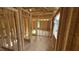 Unfinished hallway with visible framing, offering a glimpse into the home's construction and design at 91 Gobbler Dr, Smithfield, NC 27577